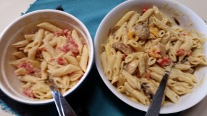 Cheese-ish Sauce with Butternut Squash on pasta (left side has rotel tomatos added; right side has sauted musrhooms, onions, and bell peppers added)